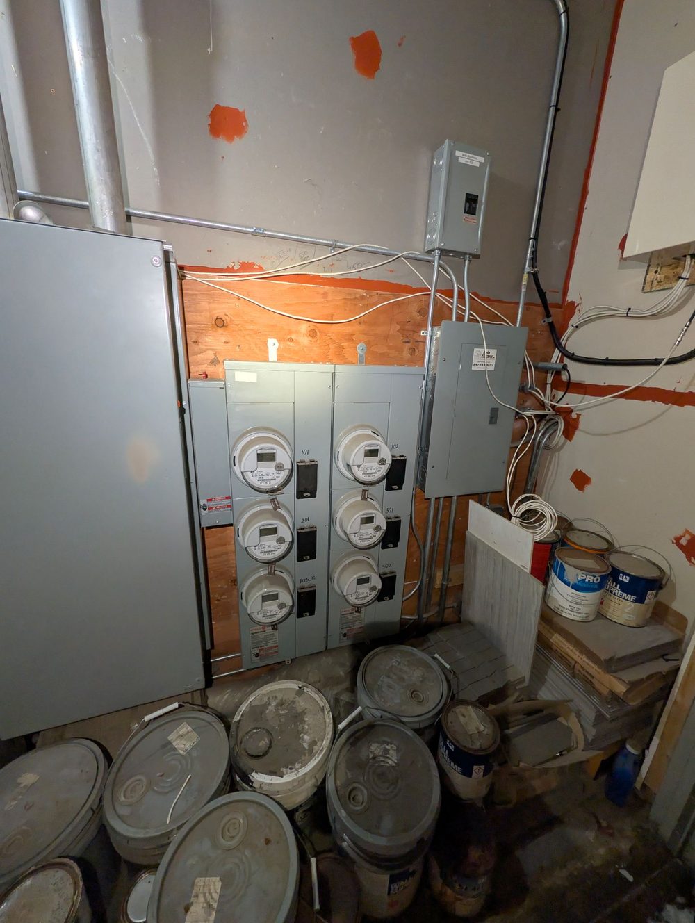 Multi-meter service and panel work in a Chicago basement